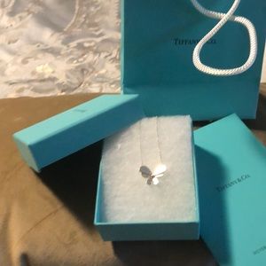 Tiffany butterfly necklace . Still in box and bag.